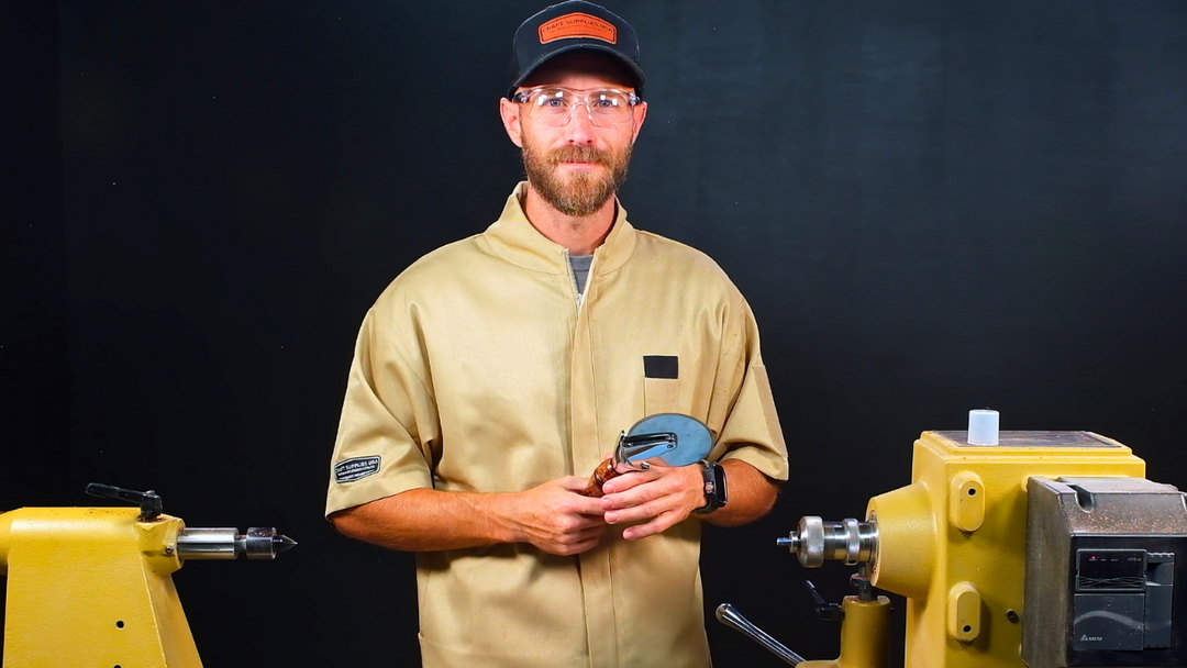 mike at the lathe with a turned pizza cutter