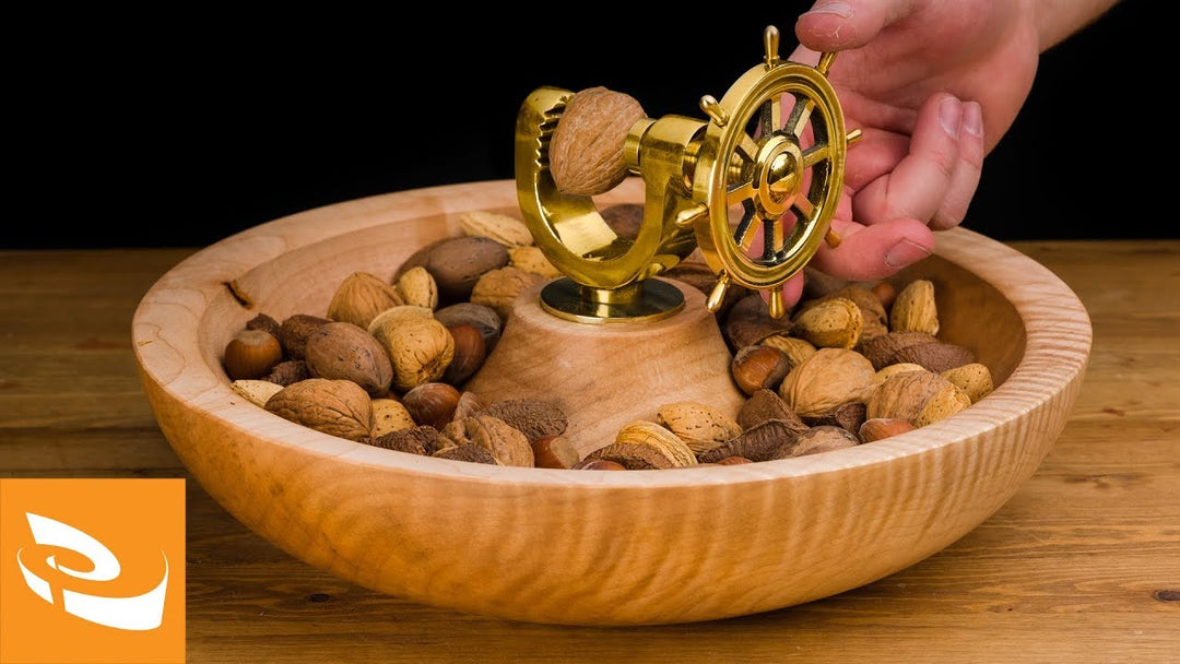Cracking a nut with a nutcracker.