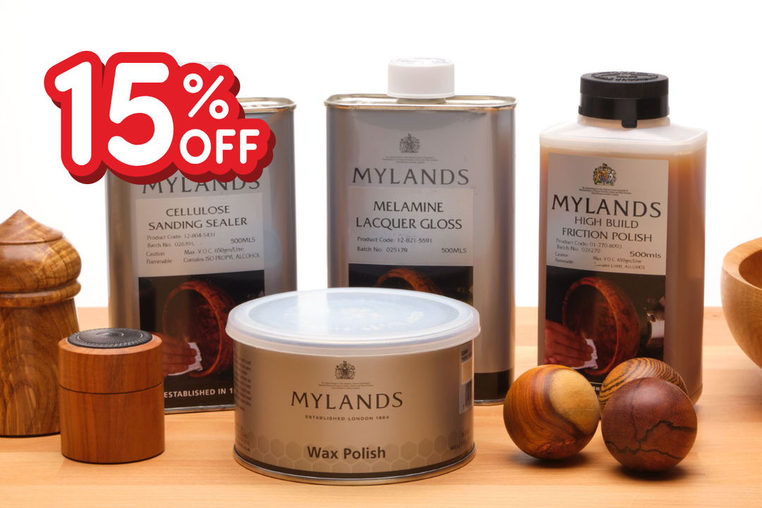 Mylands wood finishing products with turned items on a table, including '15% OFF' label.