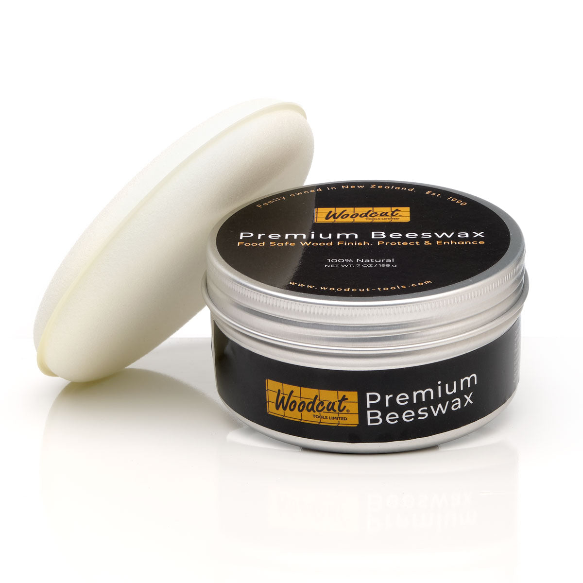 Jar of Woodcut Premium Beeswax with a applicator on a white background